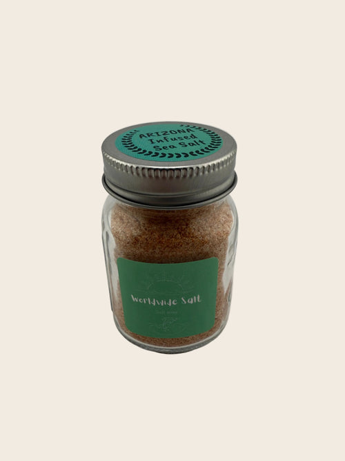 Jar of spice with a green label on a light gray background