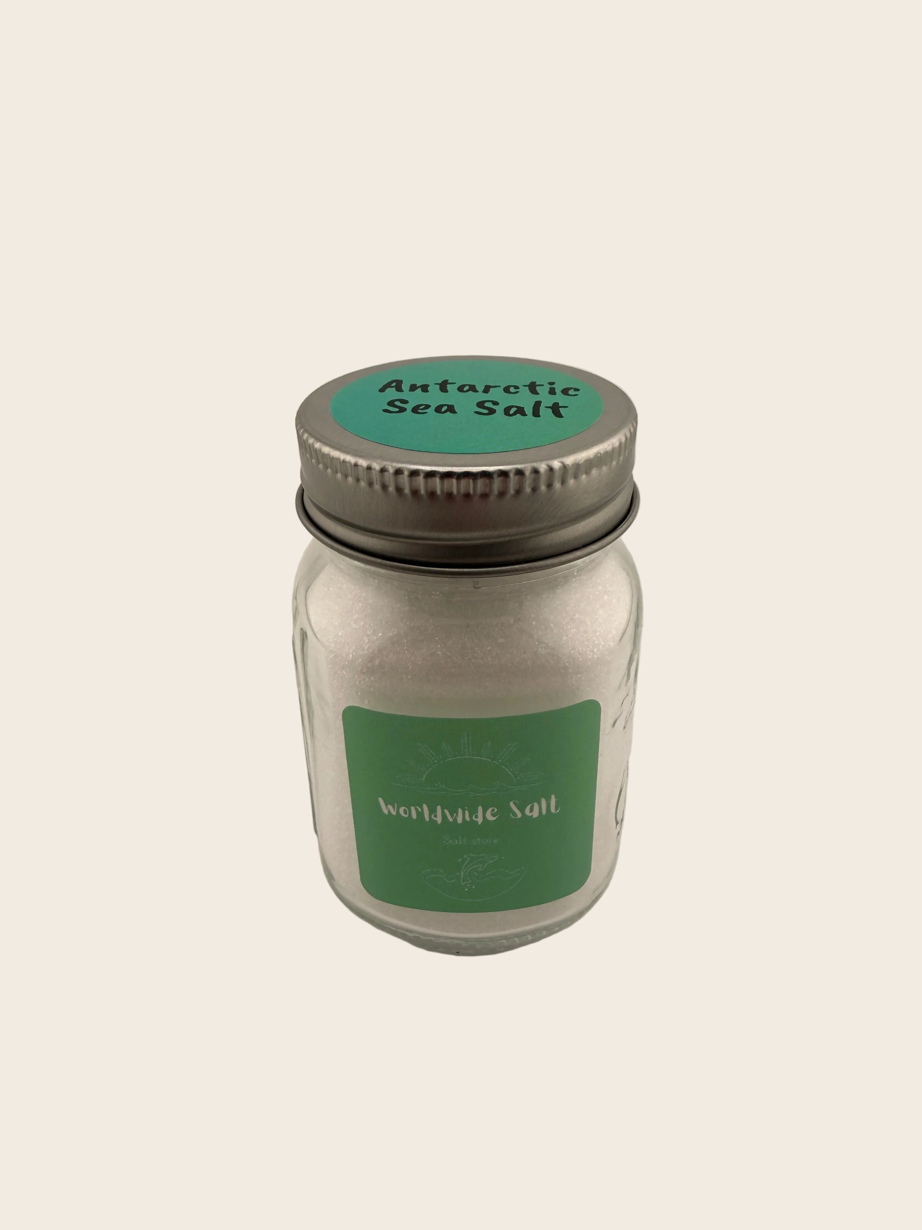 Jar of Antarctic Sea Salt with a green label on a beige background