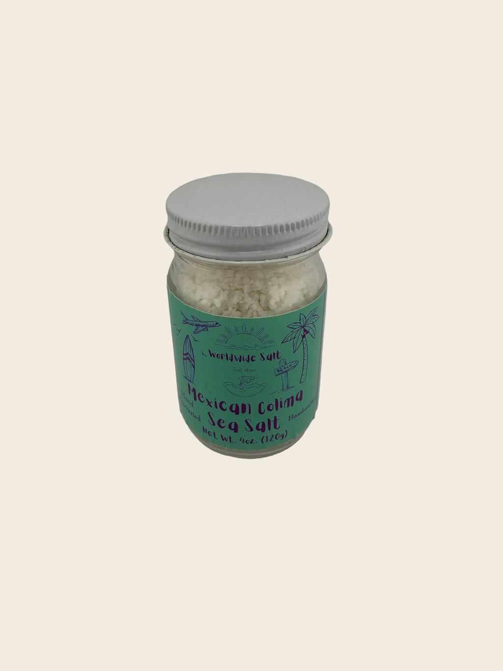 Jar of Mexican Colima sea salt with a green label on a gray background
