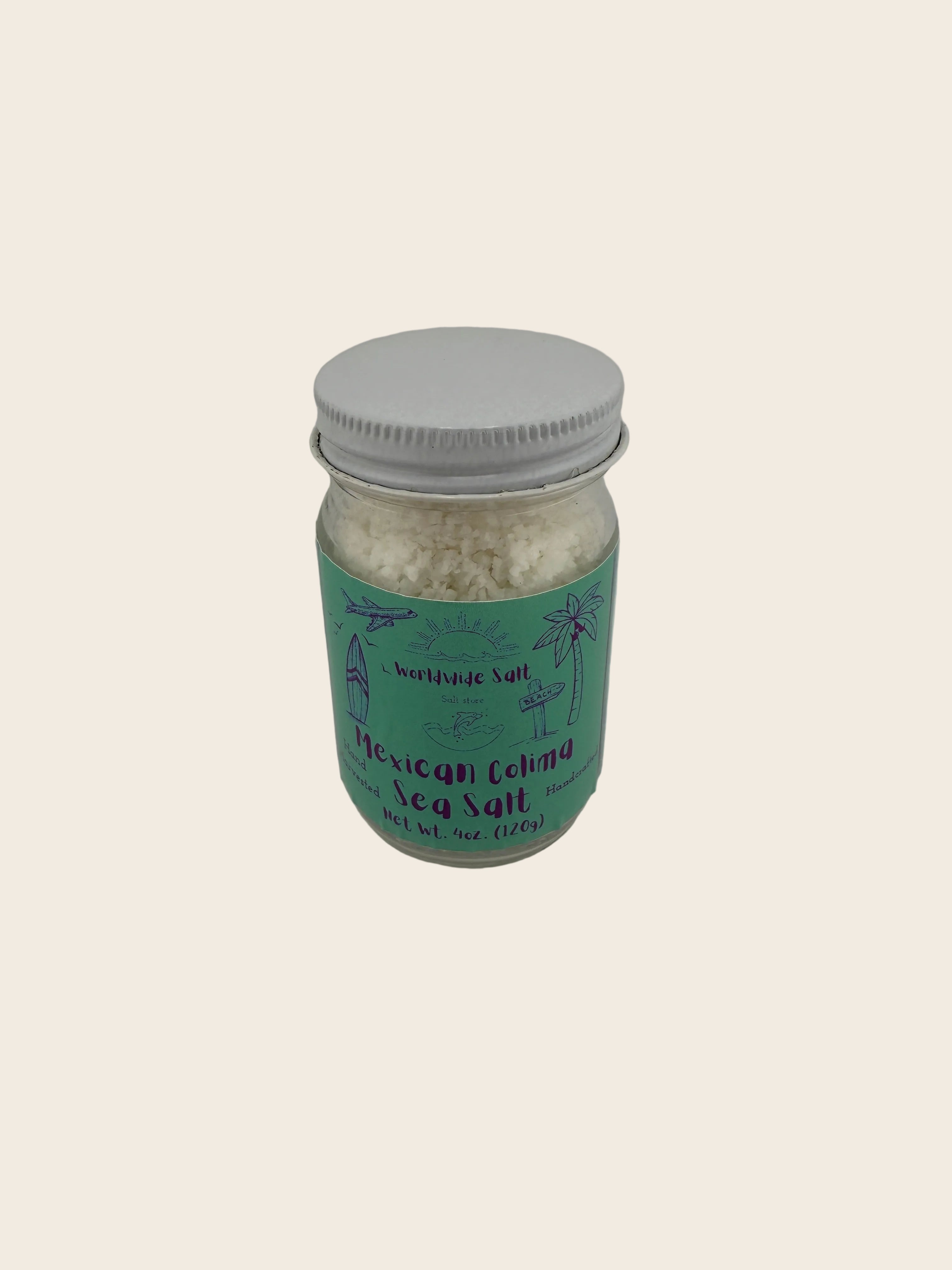 Jar of Mexican Colima sea salt with a green label on a gray background