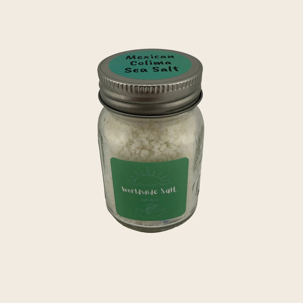 Jar of Mexican Colima Sea Salt with a green label on a light gray background