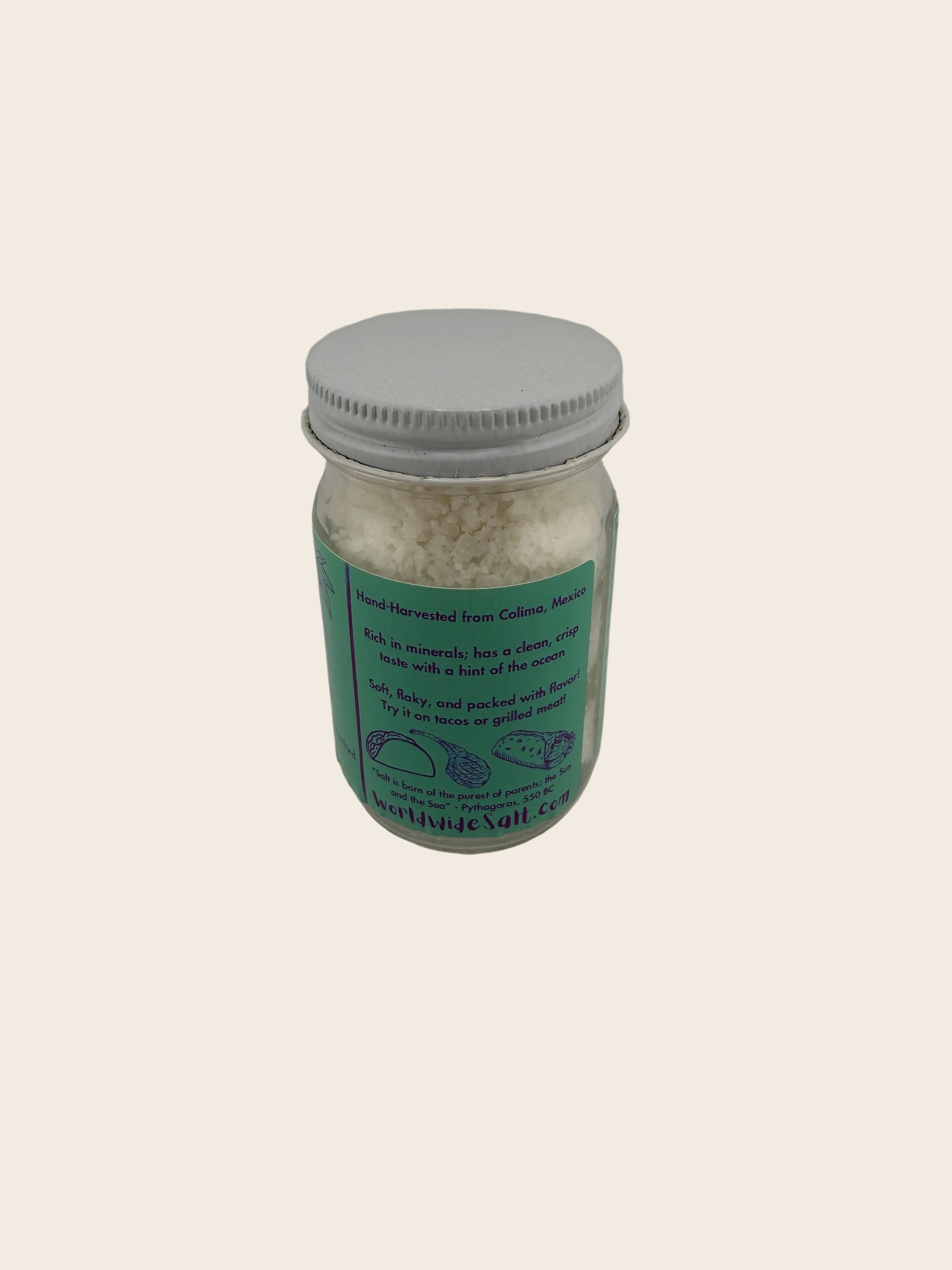Jar with a green label on a plain background
