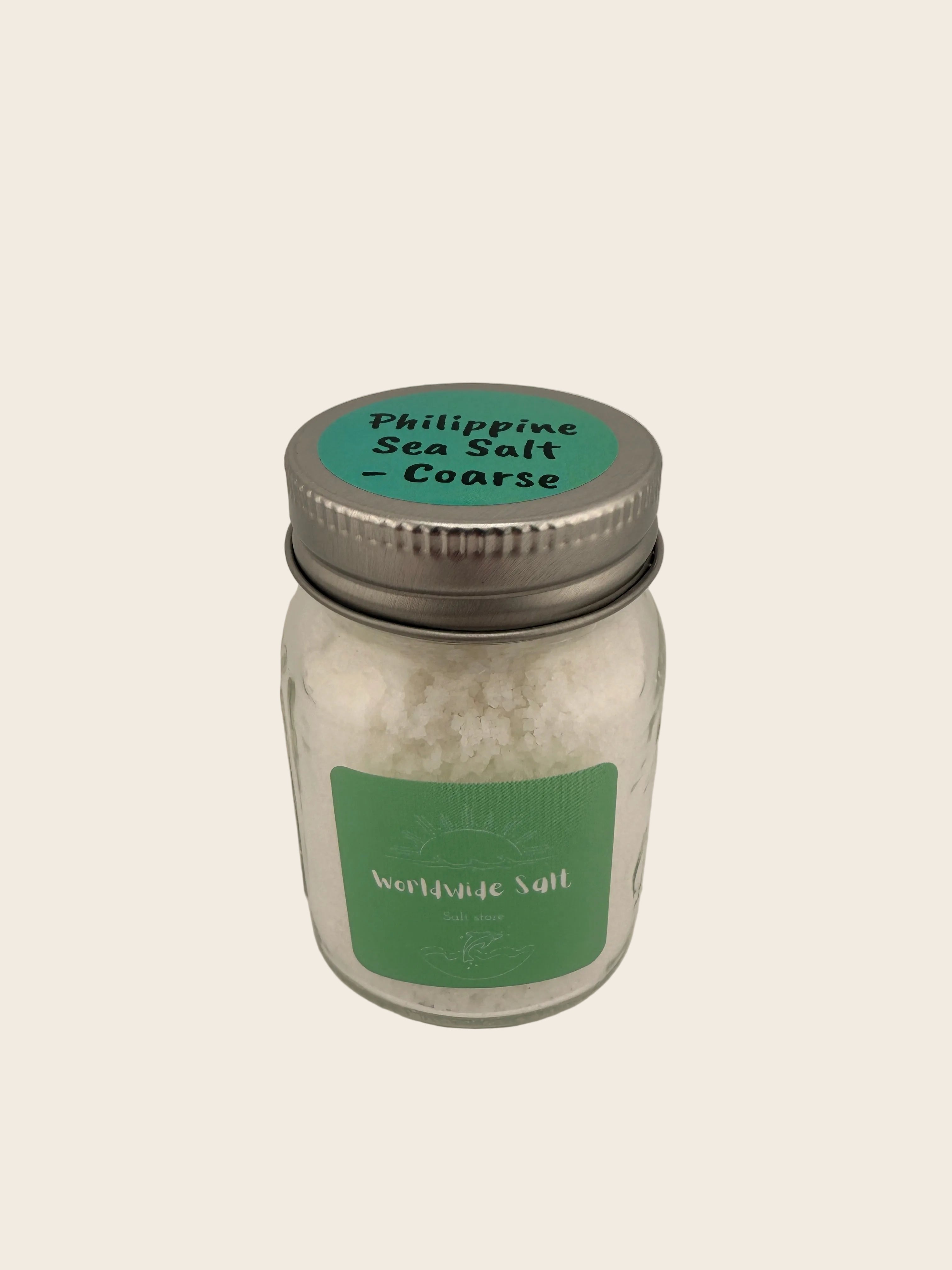 Jar of Philippine Sea Salt on a neutral background