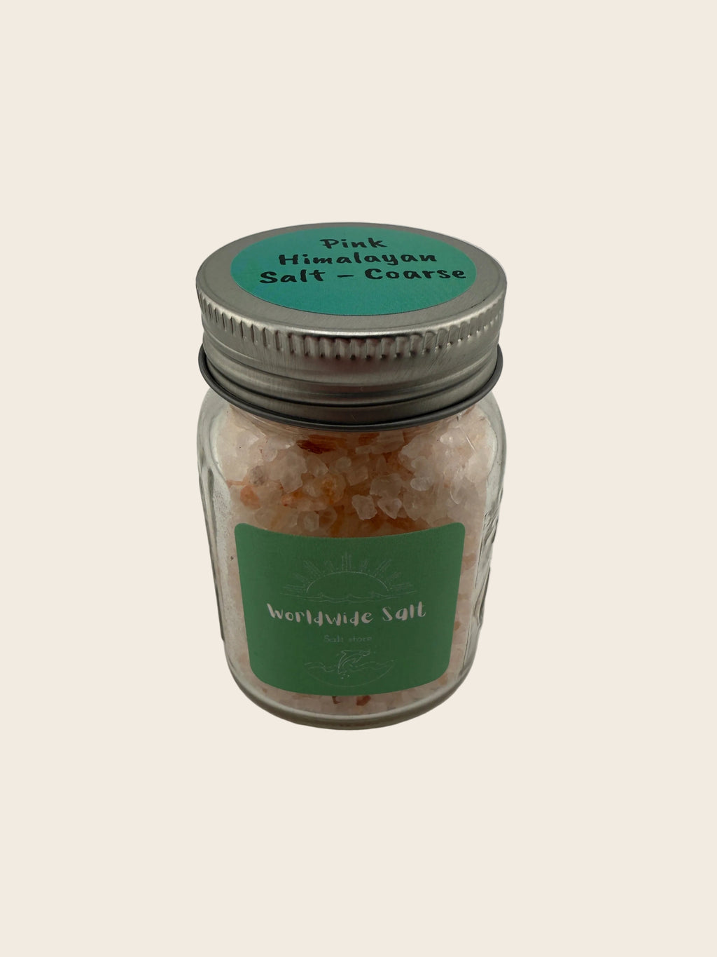 Jar of Himalayan salt with a green label on a white background