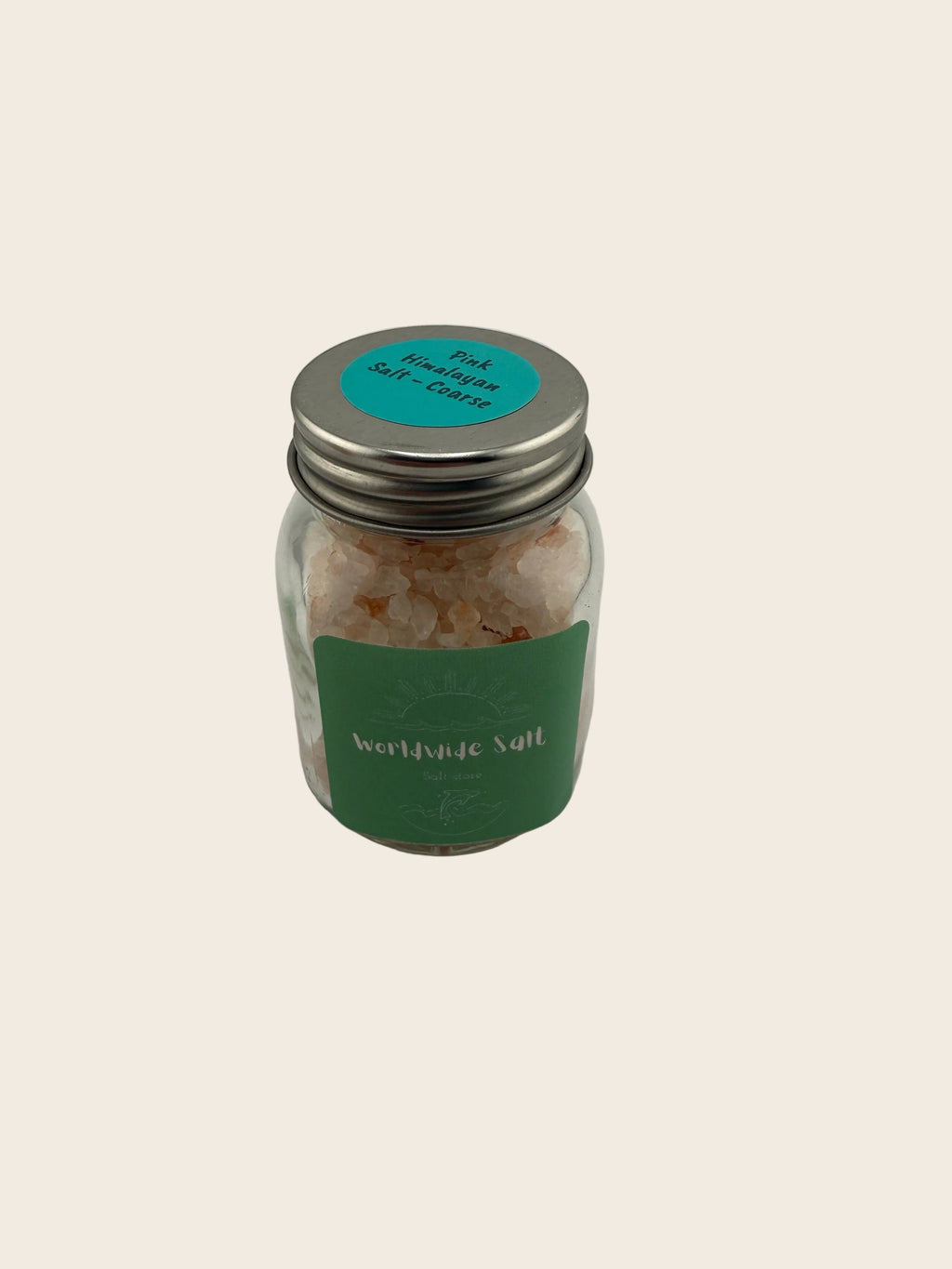 Small glass jar with a metal lid on a light gray background