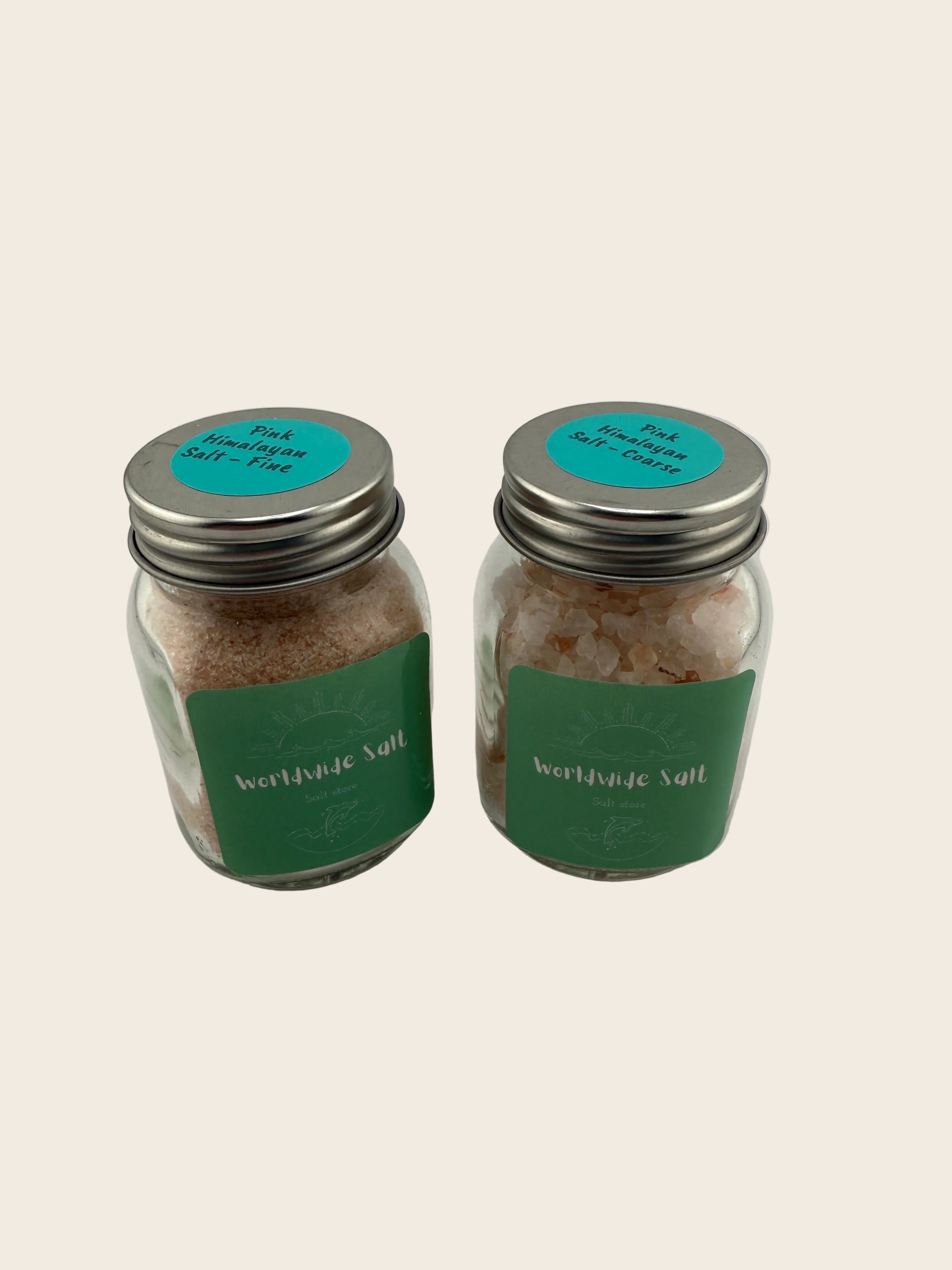 Two small jars with green labels on a light gray background