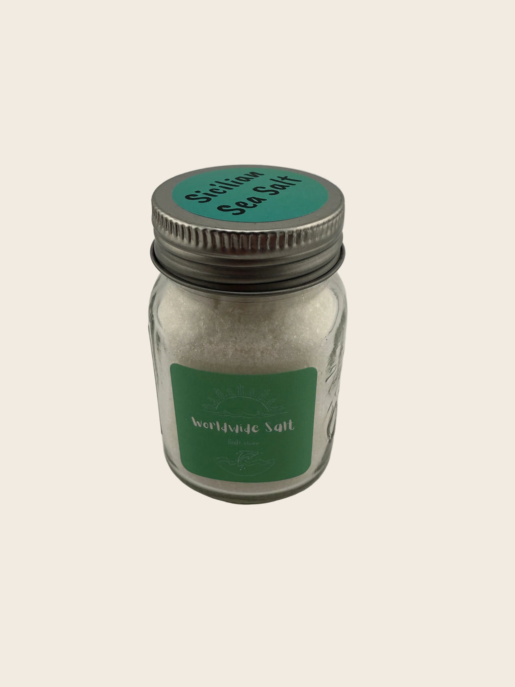 glass jar with a metal lid on a light gray background