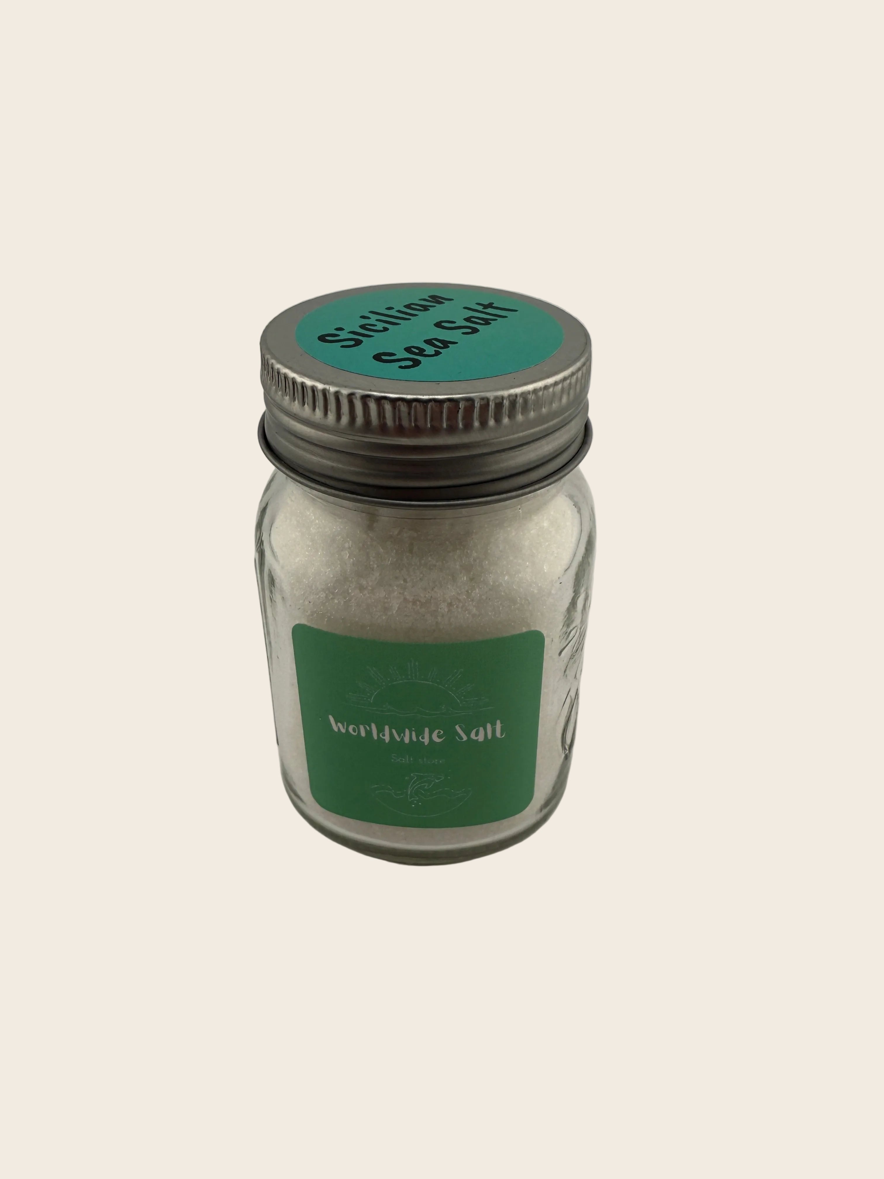 glass jar with a metal lid on a light gray background