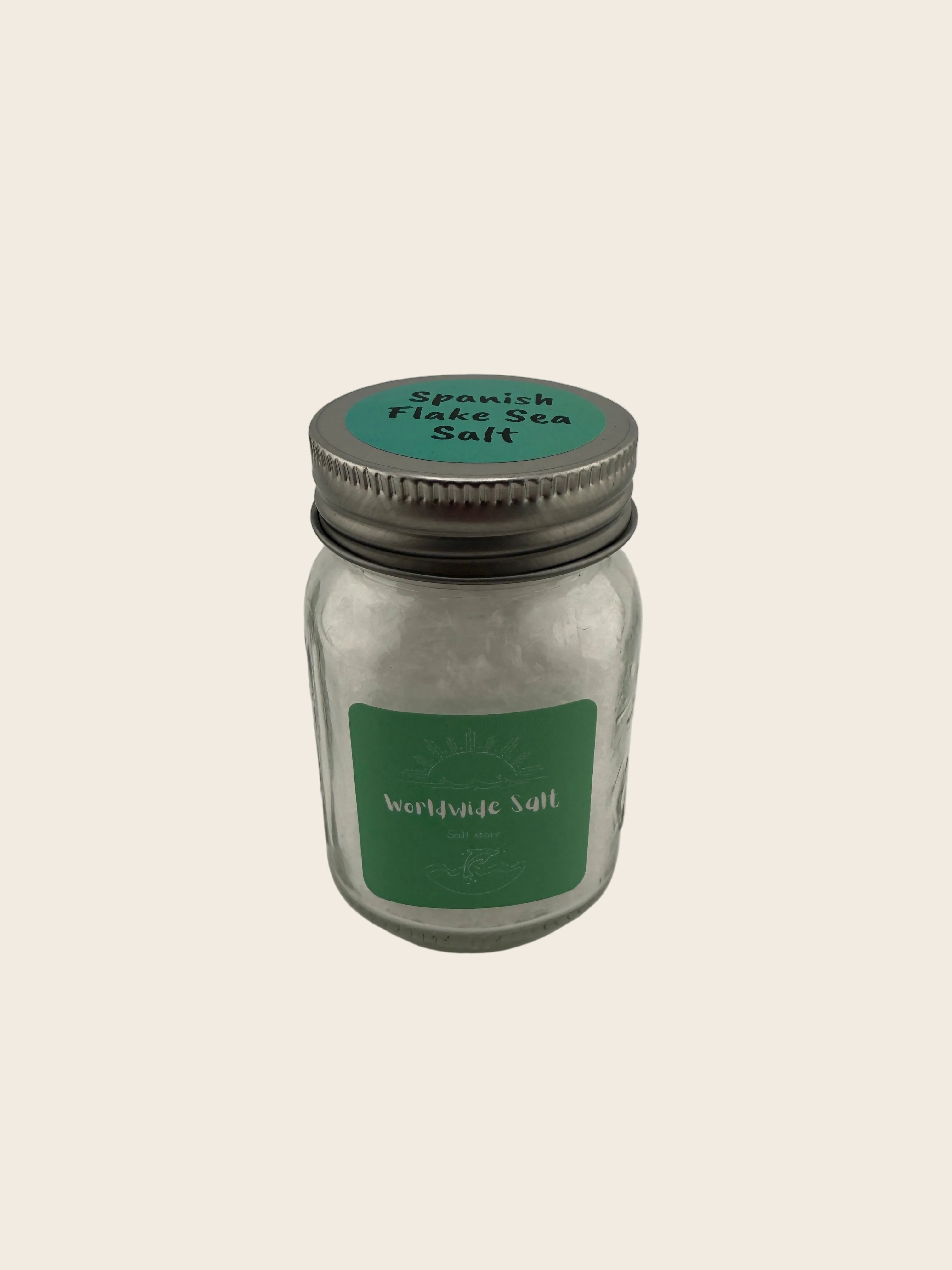 Jar of salt with a green label on a light gray background